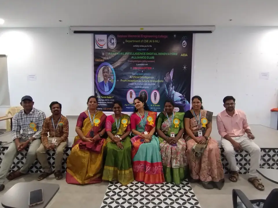 Seated with faculty at an AI / AIDIA academic inauguration session.